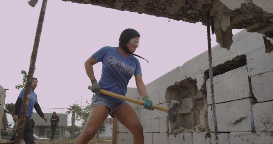 A member of the Los Angeles 1st Platoon breaking down walls for the Stevenson Project